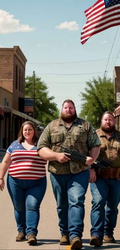 Three individuals walk down a small town street with an American flag overhead.