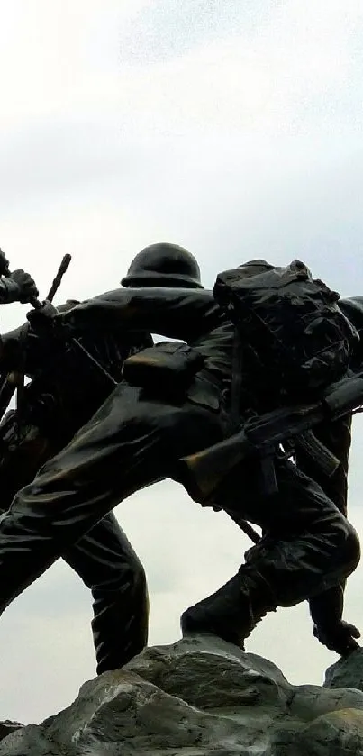 Statue of soldiers raising the Indian flag, symbolizing unity and bravery.