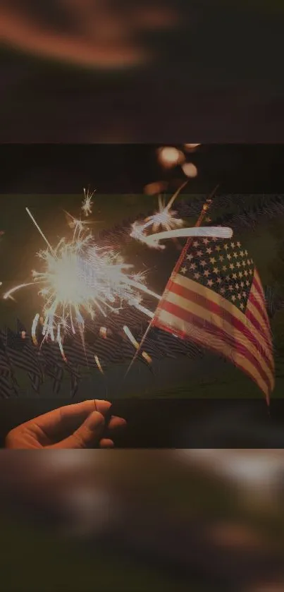 Person holding sparkler with American flag in background.