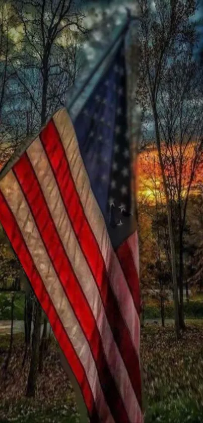 American flag waving in sunset landscape with trees.