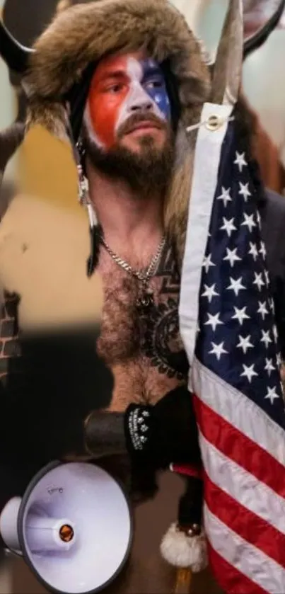 Bearded man in tribal attire with face paint and American flag.