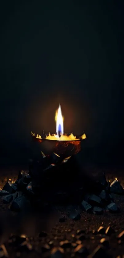 A candle flickers calmly in darkness, illuminating the space around it.