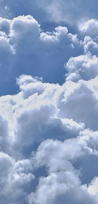 Mobile wallpaper featuring fluffy clouds against a light blue sky.