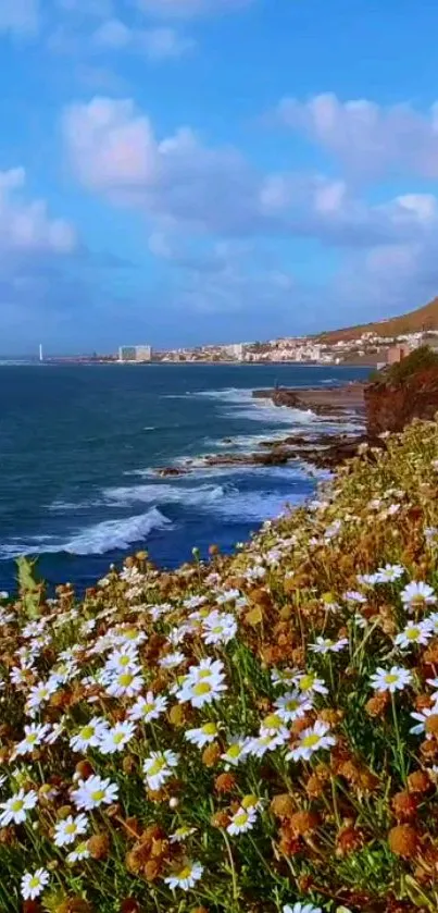 Ocean view with flowers on cliffside under a blue sky.