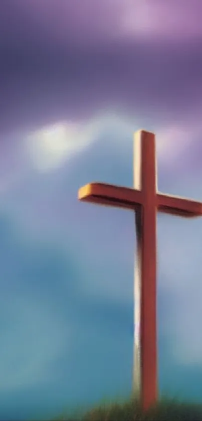 Wooden cross in front of colorful, tranquil sky.