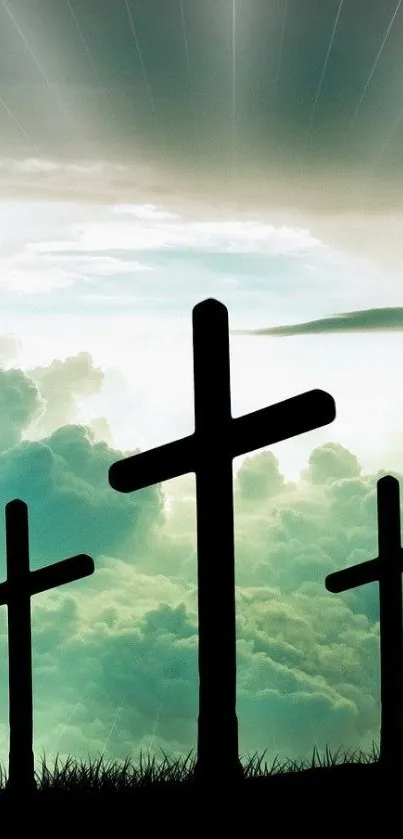 Wallpaper of silhouetted crosses against a cloudy blue sky.