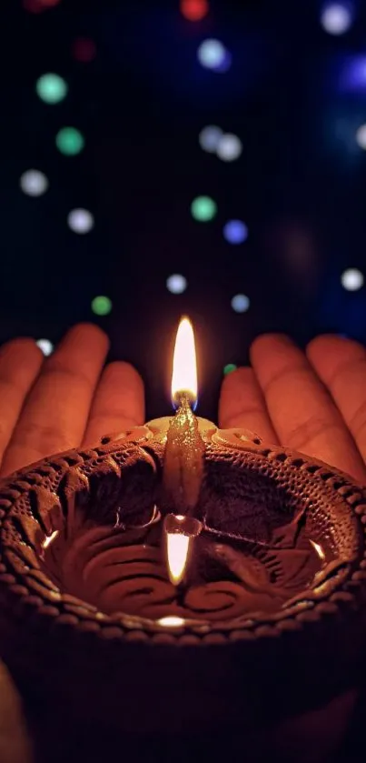 Diya in hands with colorful bokeh background, symbolizing Diwali celebration.