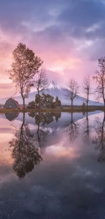 Serene sunset over a lake with tree reflections and distant mountains.