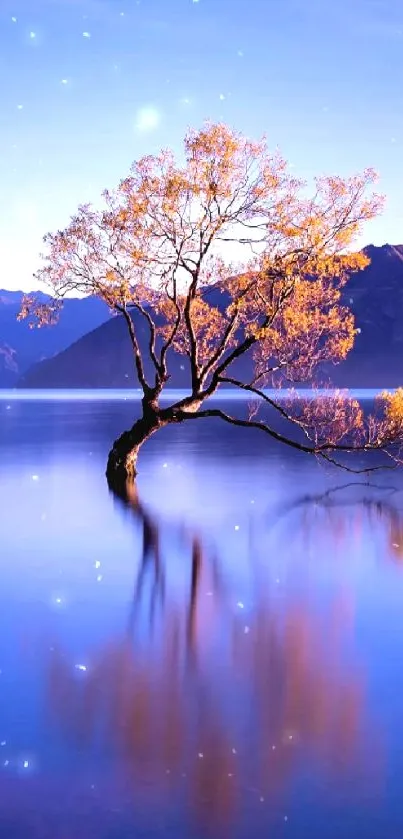 Serene lake with tree and mountains at sunset.