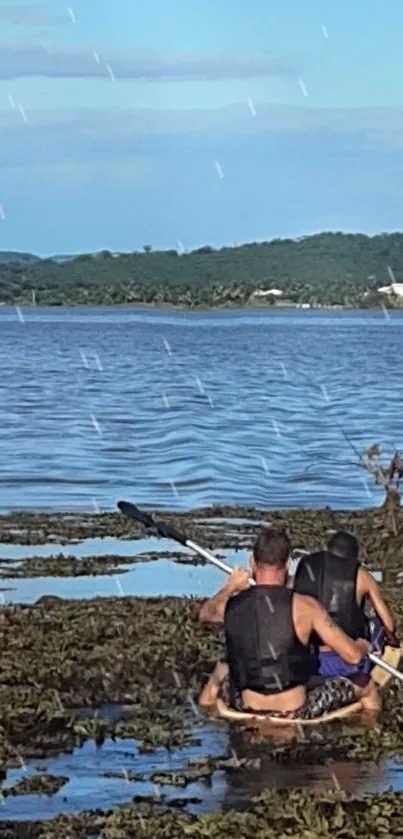 Two kayakers enjoying a peaceful lake adventure under a clear blue sky.