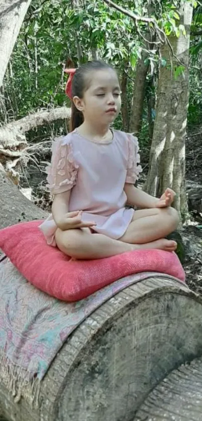 Child meditating on a log in a peaceful forest.