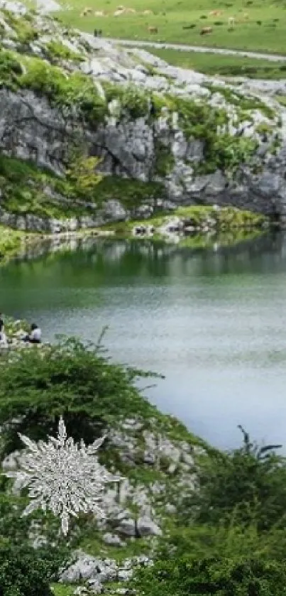 Serene mountain lake with lush green hills and blue sky.