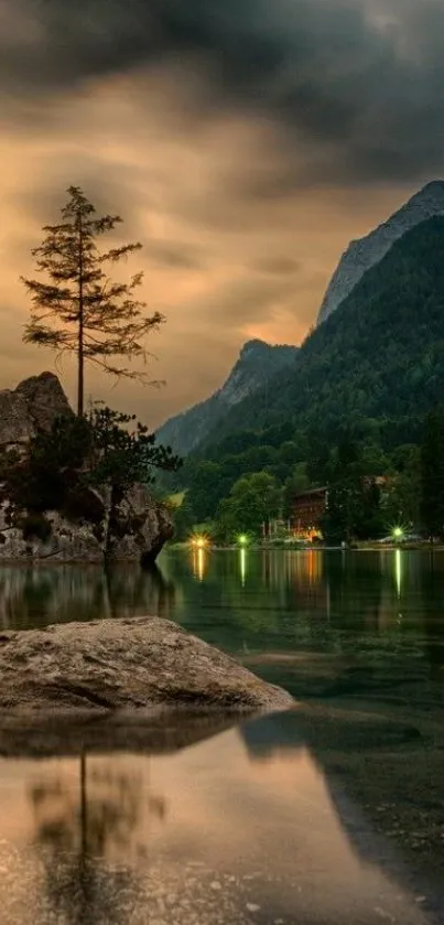 Serene mountain lake at sunset with reflections.