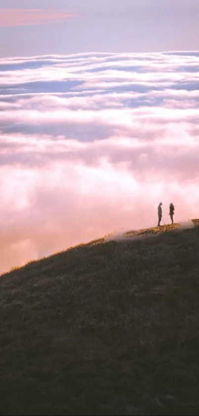 Two figures stand on a mountain with clouds and lavender sky.