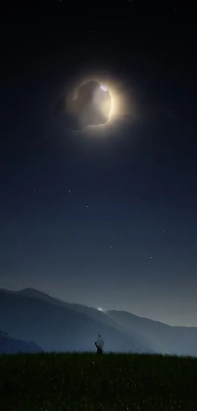 A serene night sky with a glowing moon over a silhouetted mountain landscape.