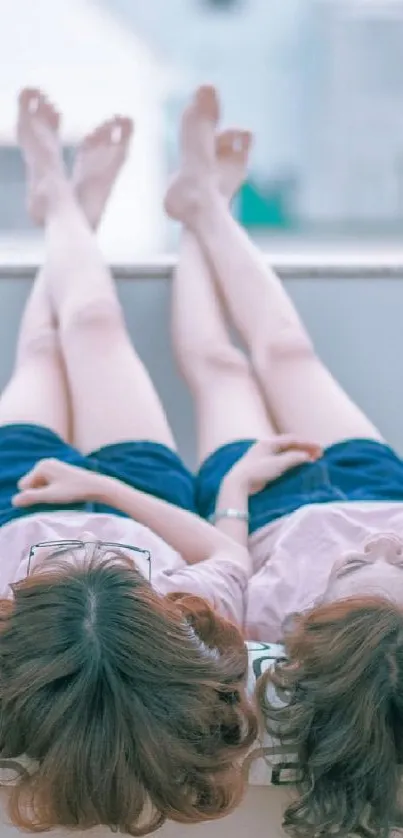 Two friends relaxing outdoors on a sunny day.