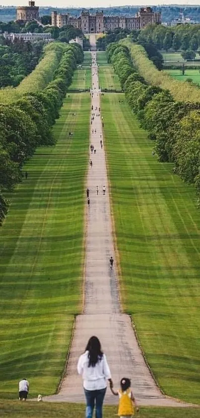 Long green path leading to distant castle with lush trees.