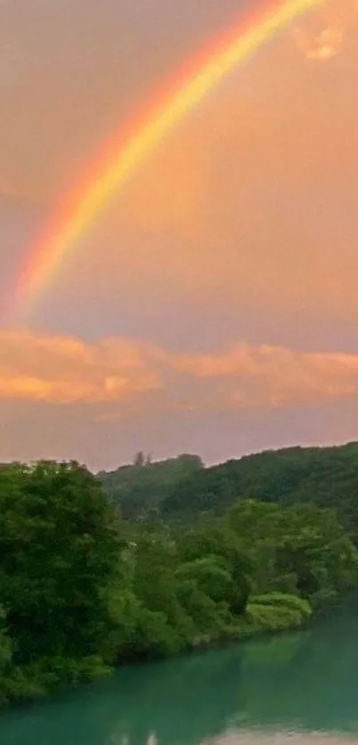 Colorful rainbow over a lush forest and serene river.