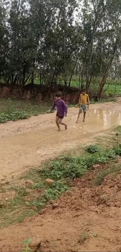 Two children walking along a muddy rural pathway in a peaceful, natural scene.