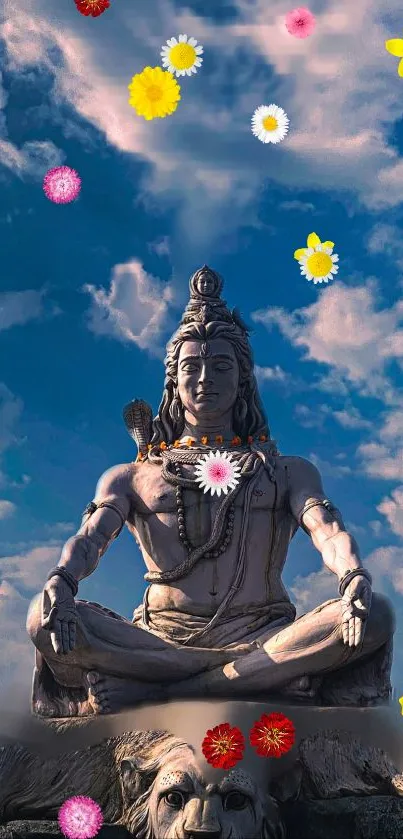 Serene Shiva statue with colorful flowers under a sky blue background.