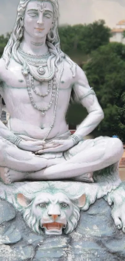 Statue of Shiva in peaceful meditation scene.