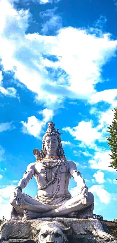 Statue of Lord Shiva beneath a vibrant sky.