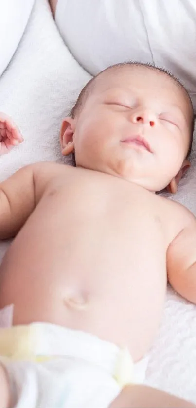 A peaceful sleeping baby on a soft, white blanket, creating a serene ambiance.