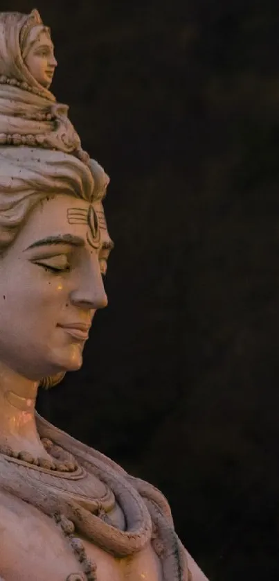 Peaceful stone statue set against a serene natural background.