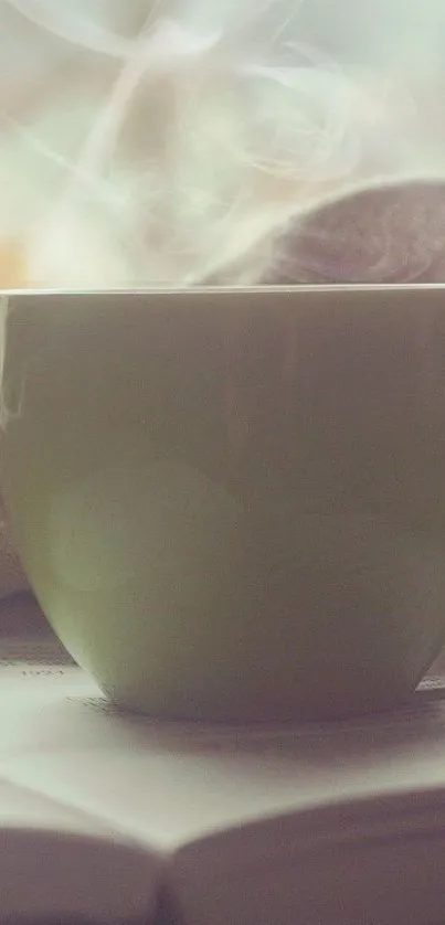 Light green tea cup on a surface with steam rising.