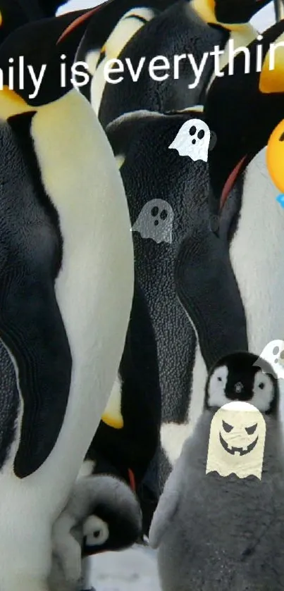 Playful penguins with ghost costumes on a mobile wallpaper.