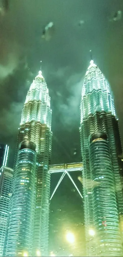 Petronas Twin Towers illuminated at night with a stunning city skyline backdrop.