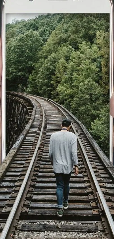 Surreal wallpaper of nature emerging from a smartphone with person walking on tracks.