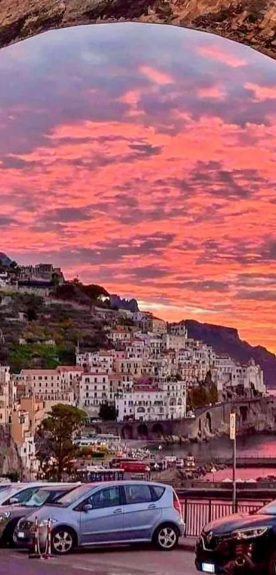 Colorful sunset over Italian coastal village, with vibrant skies and serene waters.