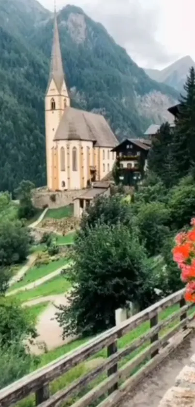 Scenic mountain village with a church, lush greenery, and vibrant flowers.