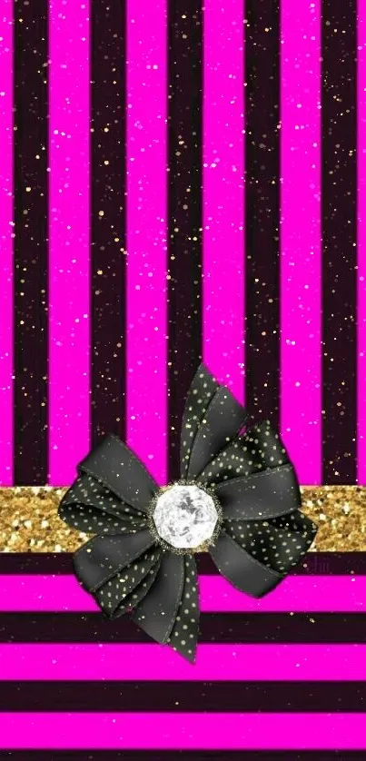 Pink and black striped wallpaper with a gold band and black bow.