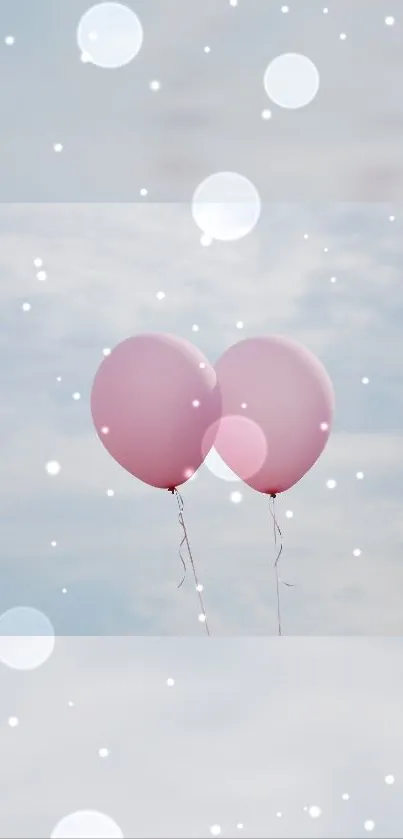 Two pink balloons against a cloudy sky with bokeh effects.