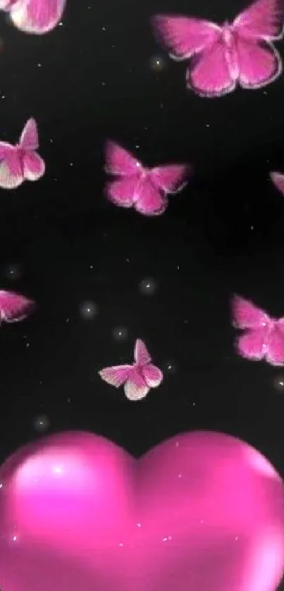 Pink butterflies and heart on black background.