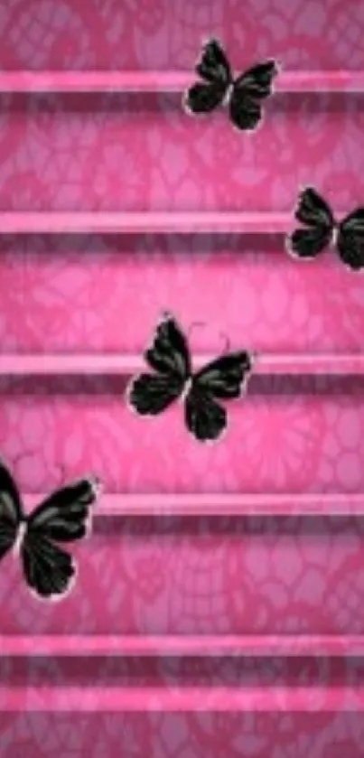 Pink wallpaper with black butterflies and lace pattern.