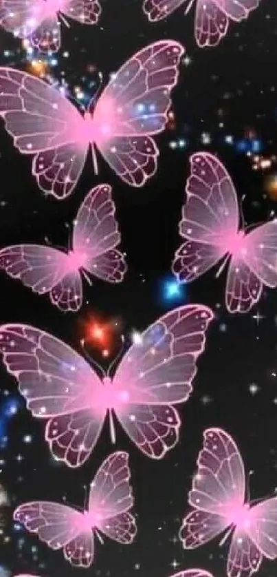 Pink butterflies float in a starry night sky wallpaper.