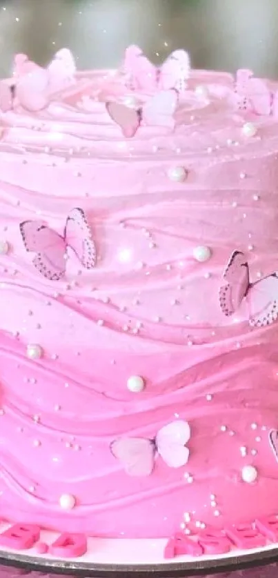 Pink ombre cake adorned with butterflies.