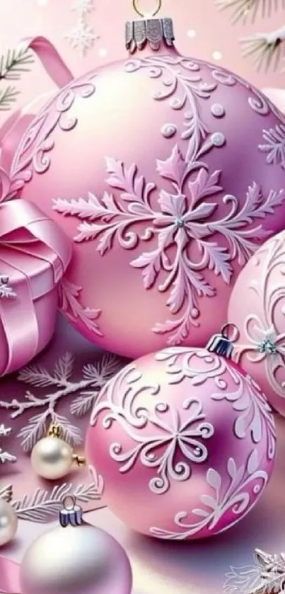 Pink Christmas ornaments with snowflake designs.