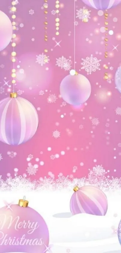 Pink Christmas ornaments with snowflakes on a festive background.