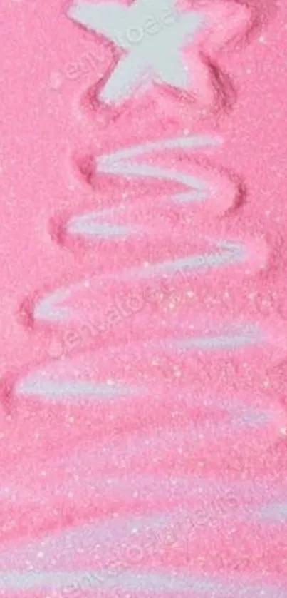 Pink sand Christmas tree with star design.