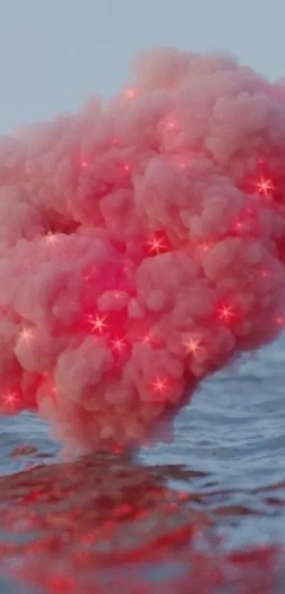 Mesmerizing pink cloud floating over calm ocean.