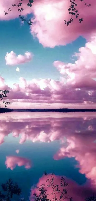 Stunning pink clouds reflected over a tranquil lake, creating a serene landscape view.