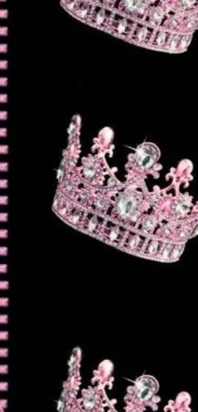 Pink sparkling crowns on black wallpaper design.