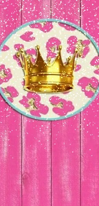 Pink background with golden crown on a wooden texture.