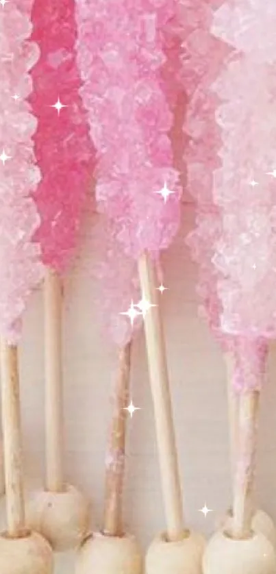 Pink crystal candy sticks arranged vertically, creating a playful pattern.