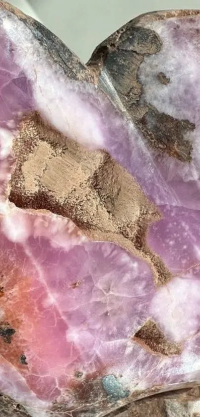 Close-up of pink crystal rock texture with natural patterns.