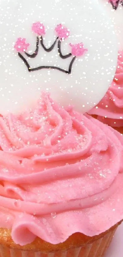 Pink frosted cupcakes with crown and star decorations, perfect as a sweet wallpaper.